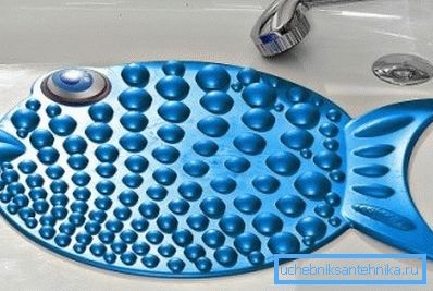 Photo d'un tapis de douche en forme de poisson. Photo d'un tapis de douche en forme de poisson.
